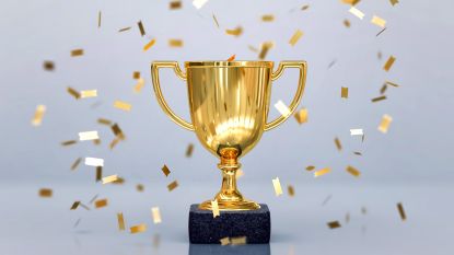 gold trophy with gold confetti surrounding it